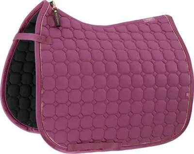 A close-up, studio shot of a purple horse saddle pad with a black underside and gold trim.
