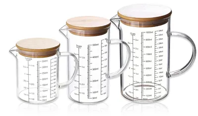 Image de Ensemble de verres doseurs, 3 pièces, en verre résistant à la chaleur : 1 litre, 500 ml et 350 ml. Fabriqués en verre borosilicaté avec poignée et bec verseur