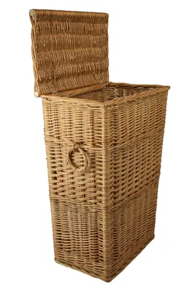 A wicker laundry basket with its lid open, shown against a white background.