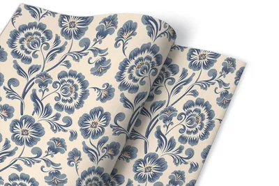 A close-up of a roll of floral patterned adhesive foil.