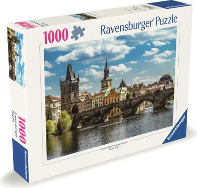 A Ravensburger puzzle box featuring a scenic view of Prague's Charles Bridge.
