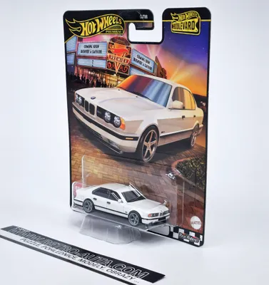 A Hot Wheels Premium Boulevard collectible toy car, a white BMW M5, displayed in its original packaging against a white background.