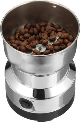 A close-up view of a coffee grinder filled with coffee beans.