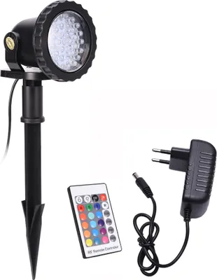 A garden spotlight with its accessories, including a remote control and power adapter, displayed against a white background.