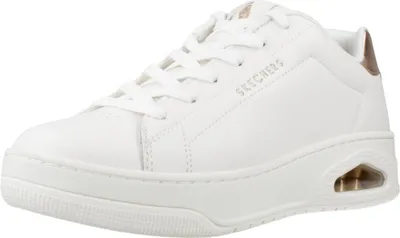 A white Skechers sneaker with gold accents is shown from the side against a white background.