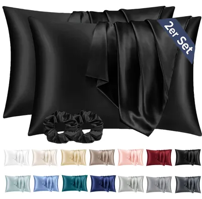 Produktbild von Set mit 2 Satin-Kissenbezügen, 40 x 80 cm, schwarz, seidenweich und pflegeleichter als Seidenkissenbezüge. Inklusive 2 Haargummis.