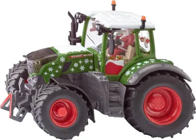 A toy tractor decorated for Christmas, with Santa Claus inside the cabin.