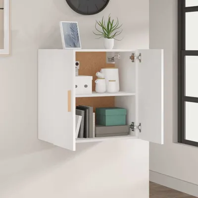 A white wall-mounted cabinet with its doors open, displaying various items inside.