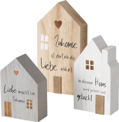 Three wooden decorative house figures with text and cut-out hearts and windows.