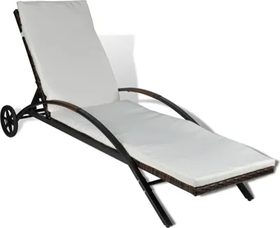 A white chaise lounge with a brown wicker frame and wheels, shown against a white background.