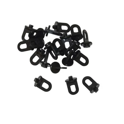 A collection of black plastic mounting brackets with loops, likely for a greenhouse.