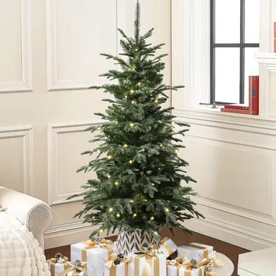 A decorated Christmas tree with presents underneath, set in a cozy room with a window and fireplace.