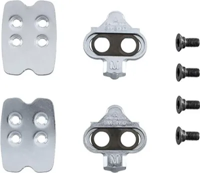 A set of bicycle cleats and mounting hardware on a white background.