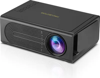 A black mini projector is shown from a slightly elevated front-left angle on a white reflective surface.