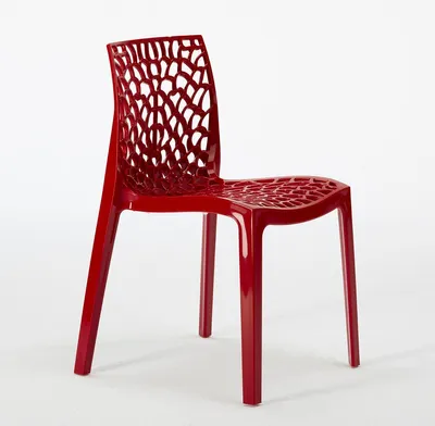 A red chair with a patterned back and seat is shown against a white background.