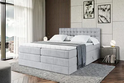 A bedroom setting with a bed.