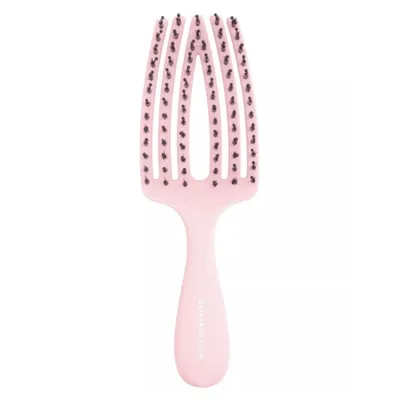 A pink hairbrush with black bristles on a white background.