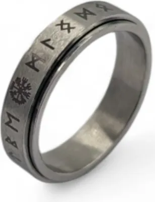 A close-up studio shot of a silver ring with engraved runes.