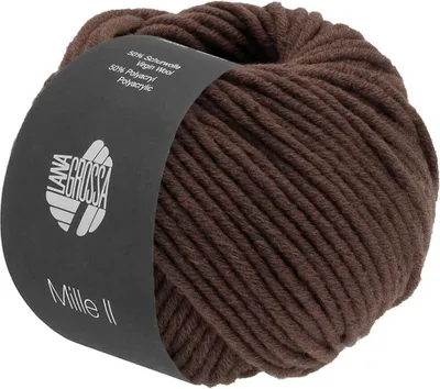 A ball of brown yarn with a dark label wrapped around it.