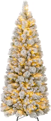 A flocked artificial Christmas tree with warm white LED lights.