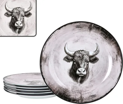 A stack of plates with a bull's head design, and a single plate in the foreground.