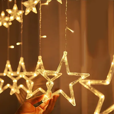 Image de Wolketon Chaîne lumineuse LED Rideau lumineux Étoiles blanc chaud 8 modes Éclairage de Noël