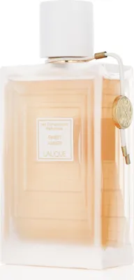 A perfume bottle with a white cap and a gold accent on a white background.