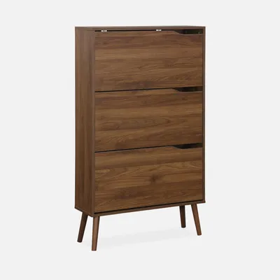 A tall, narrow shoe cabinet with three flip-down doors and angled legs, presented against a plain light gray background.
