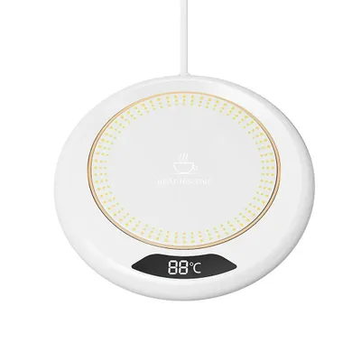 A white circular cup warmer with a digital display showing the temperature.