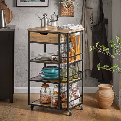 A kitchen cart filled with kitchenware and food items, placed in a kitchen setting.