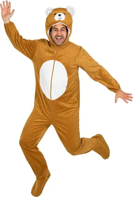 A man wearing a brown bear costume jumps in the air.