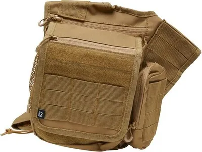 A close-up studio shot of a camel-colored tactical bag.
