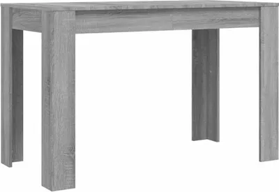 A plain studio shot of a gray wooden dining table.