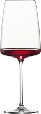 A single wine glass filled with red wine, isolated on a white background.
