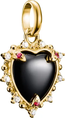 A close-up studio shot of a gold heart-shaped pendant with a black stone, accented with small red and white stones.