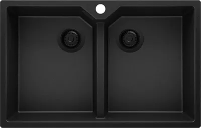 A top-down view of a black double basin kitchen sink with a faucet hole.