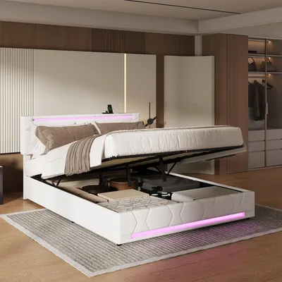 A modern bedroom with a white storage bed with LED lighting.