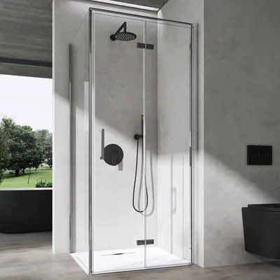 A modern bathroom with a corner shower cabin.