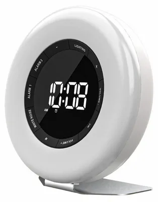 A white digital alarm clock with a black display showing the time.