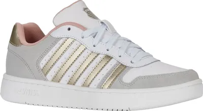 A single white sneaker with gold and gray accents is shown against a white background.