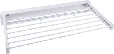 A white foldable drying rack mounted on a wall.