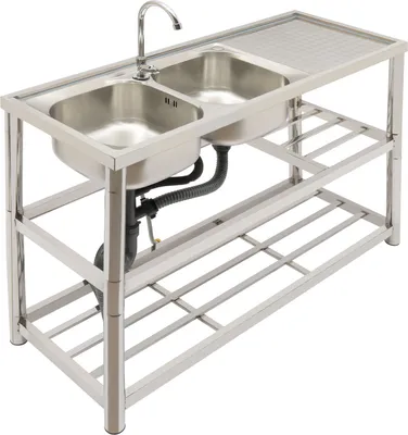 A stainless steel double sink with a faucet and drain assembly, standing on a metal frame with two shelves.