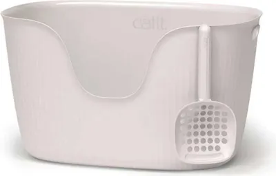 A white cat litter box with a scoop attached to the side.