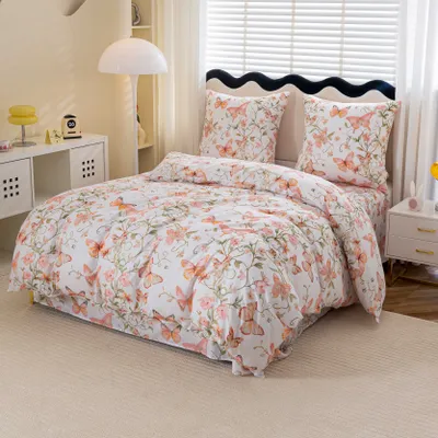 A neatly made bed with a butterfly-patterned duvet cover and pillows in a bedroom setting.