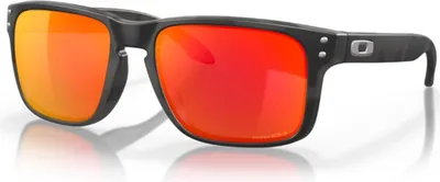 A pair of Oakley sunglasses with red lenses and a black frame is shown against a white background.
