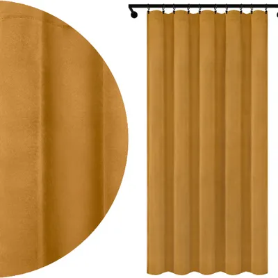 A close-up view of a mustard yellow velour curtain hanging from a black curtain rod, with a detailed texture shown on the left side of the image.