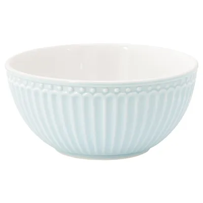 A light blue ceramic bowl with a fluted design and a beaded rim, shown from a side angle against a white background.