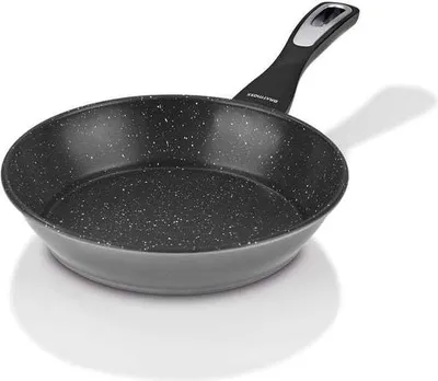 A black frying pan with a speckled interior and a black handle with a silver accent, shown on a white background with a shadow.