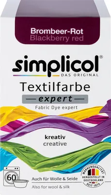 The image shows the packaging of a fabric dye product. The packaging features the brand name, product name, color name, and illustrations of colorful flowing fabrics.
