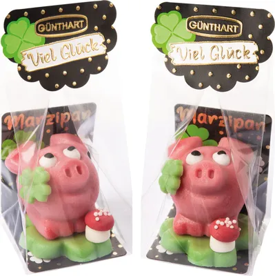 Produktbild von 2 Stück Marzipan Schweinchen auf Kleeblatt im Cellophanbeutel